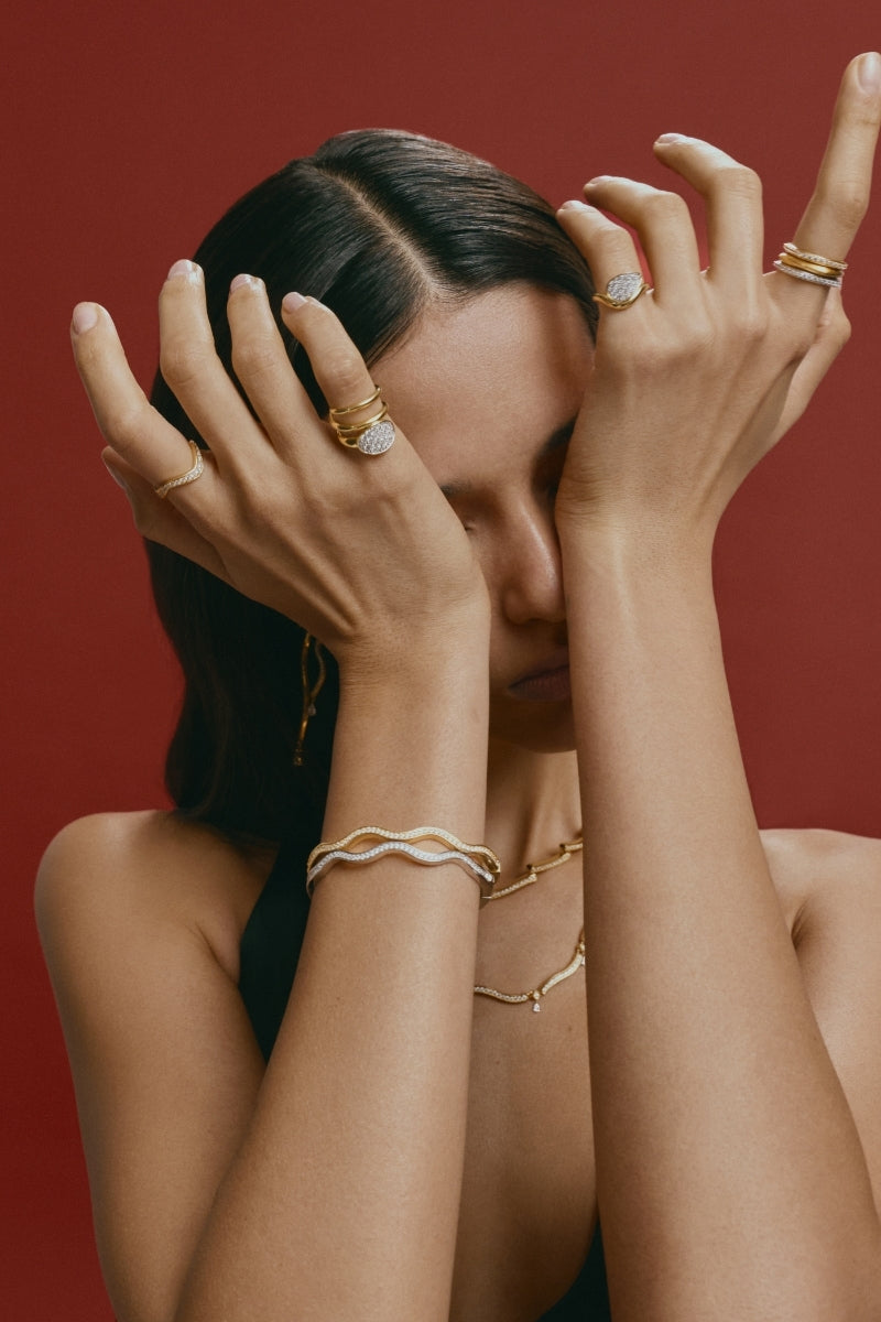 Velvet Desert Dune Teardrop Frost Pinky Ring in gold, featuring a teardrop-shaped frosted design, worn on the pinky finger.