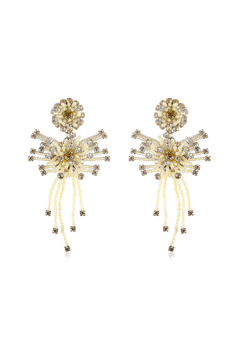 A pair of yellow drop earrings from Aidan & Ice featuring sleek, elongated design and shiny gold finish.
