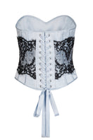 Scarlett Gasque Eclipse Corset top in ghost white with ice melt detailing, featuring a fitted design and back lacing.