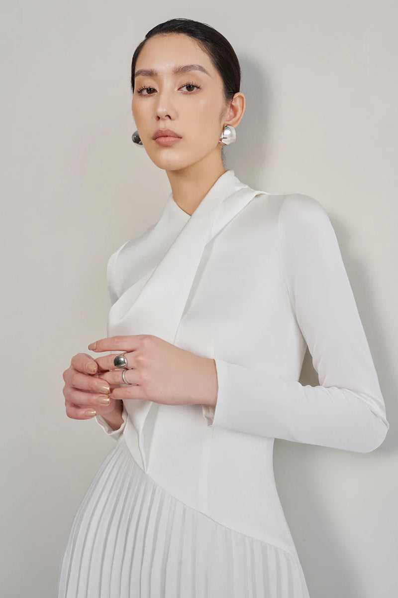 White smooth taffeta silk gown by EEGEN STUDIO, featuring elegant draping and a flowing silhouette.