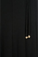Black Peper Rib Knit Maxi Dress by EEGEN Studio, featuring a fitted ribbed knit design and long sleeves.