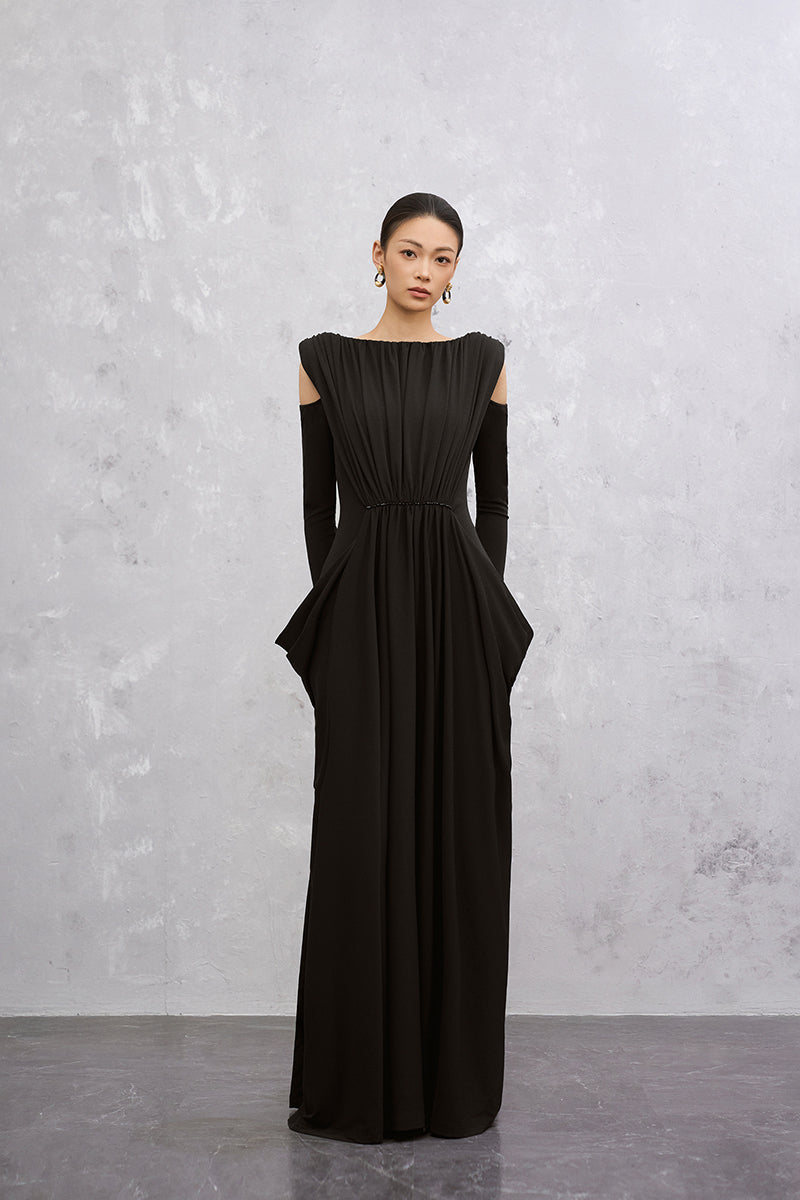 Black VELA maxi dress by EEGEN STUDIO, shown on a model featuring flowing fabric and a stylish, elegant design.