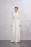White Lunaria Maxi Dress by EEGEN STUDIO with flowing fabric and elegant design, displayed on a mannequin.