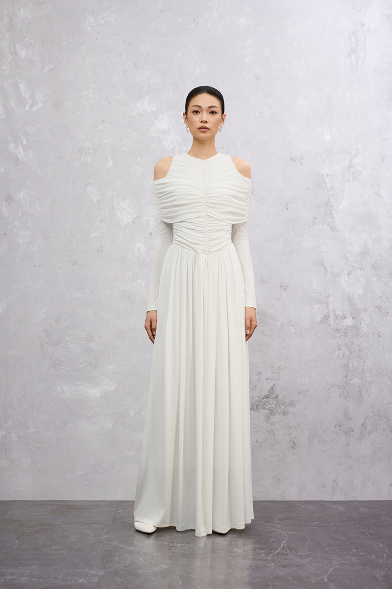 White Lunaria Maxi Dress by EEGEN STUDIO with flowing fabric and elegant design, displayed on a mannequin.