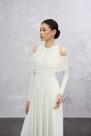 Elegant white Lunaria maxi dress by EEGEN STUDIO, flowing fabric with a fitted bodice and sleeveless design.