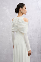 White Lunaria maxi dress by EEGEN STUDIO featuring flowing fabric and elegant design, displayed on a mannequin.