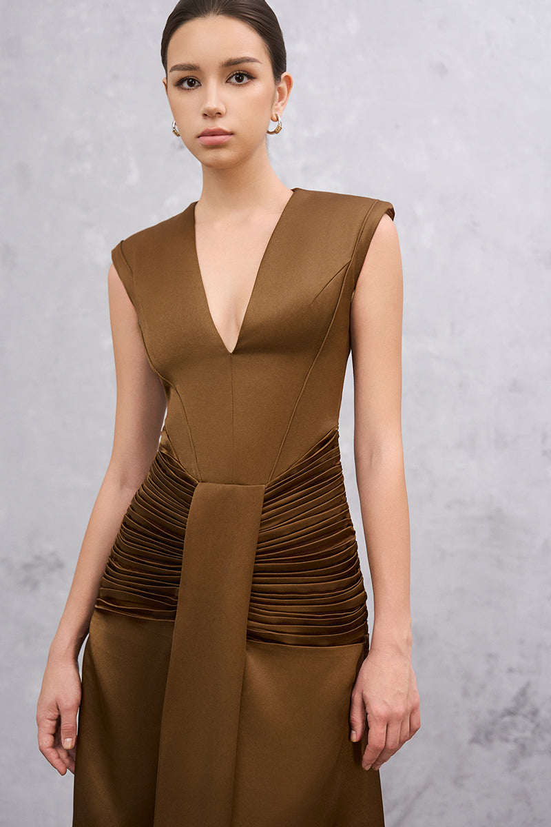 Brown AIRA maxi dress by EEGEN STUDIO featuring a flowing silhouette and elegant design, shown on a hanger.