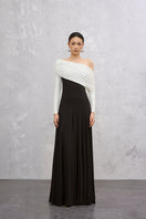 Black and white Caelis gown by EEGEN STUDIO, elegant long dress with flowing fabric and intricate detailing.