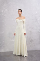 White Elowen maxi dress by EEGEN STUDIO, flowing off-white fabric with a relaxed fit and elegant design.