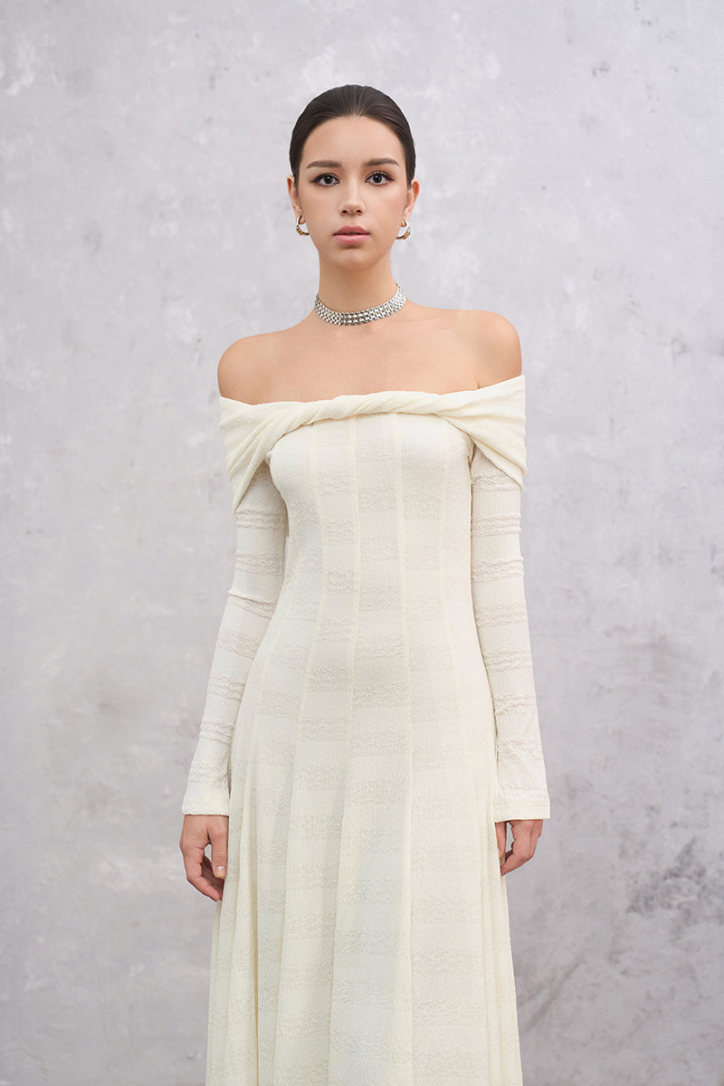 White ELOWEN maxi dress by EEGEN STUDIO, flowing fabric and elegant design, shown on a model.