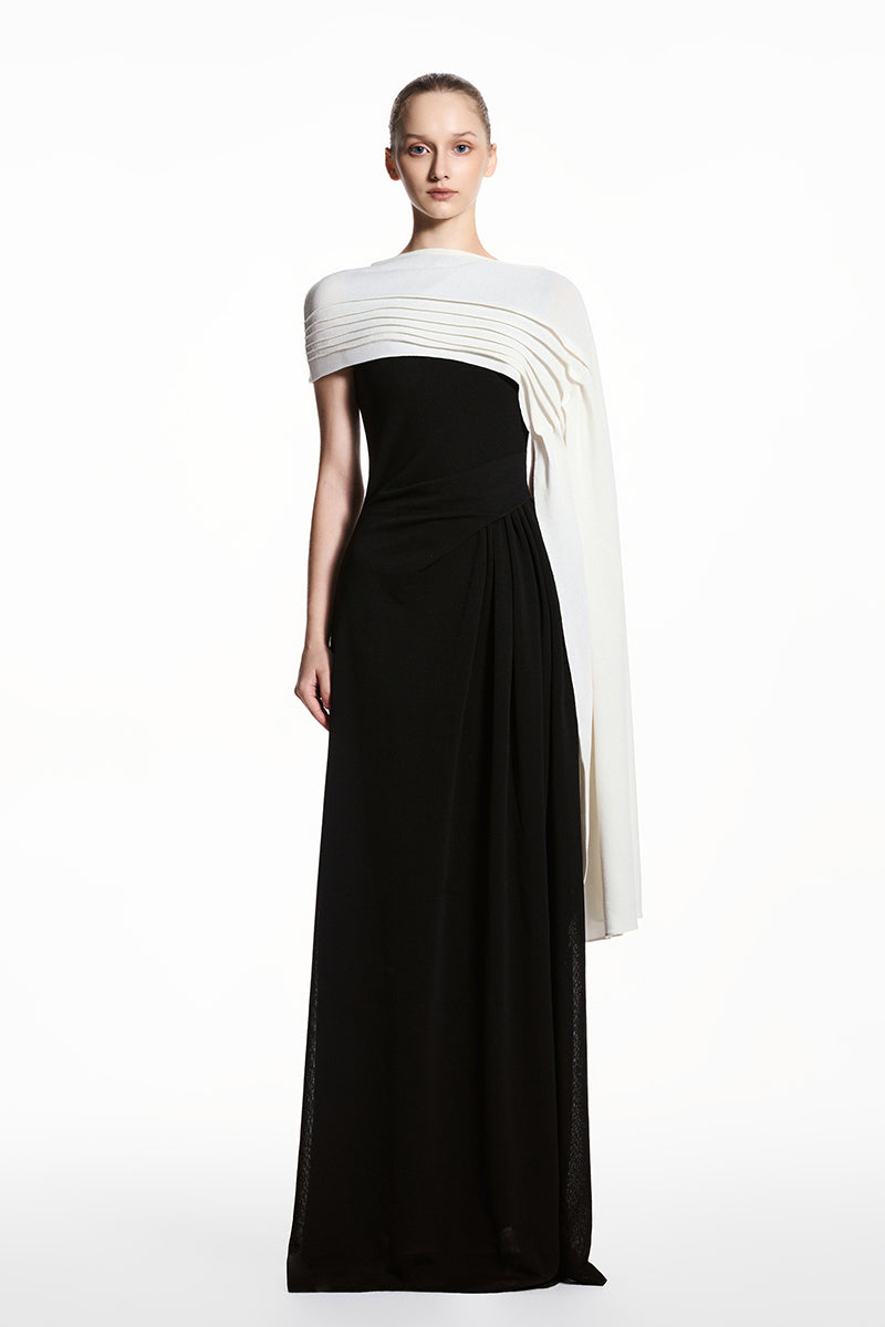 Black and white spandex light knit maxi dress by EEGEN STUDIO, featuring a sleek, fitted design with long sleeves and a flowing silhouette.
