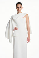 White spandex maxi dress by EEGEN STUDIO featuring a fitted silhouette and elegant design, shown on a model.