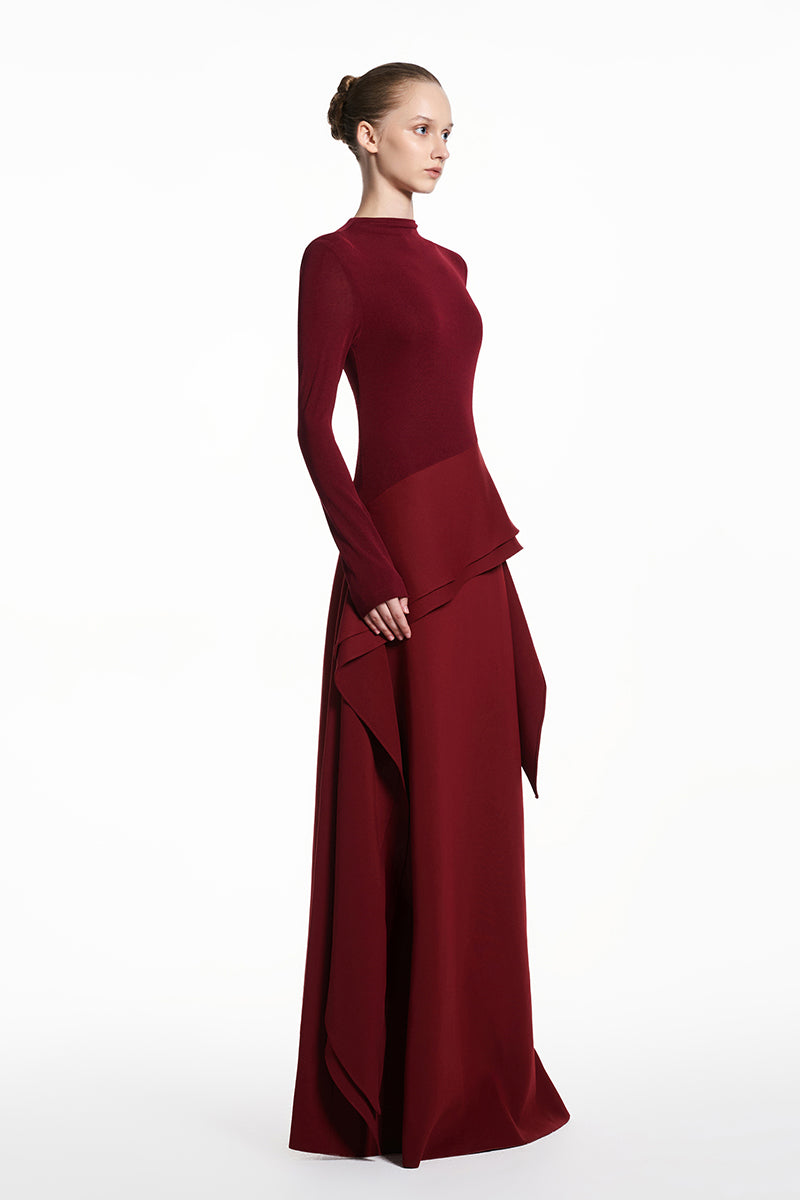 Red spandex jersey gown by EEGEN STUDIO featuring a fitted silhouette and elegant design, shown on a model.