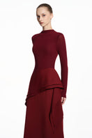 Red spandex jersey gown by EEGEN STUDIO, featuring a sleek, fitted design with long sleeves and elegant neckline.