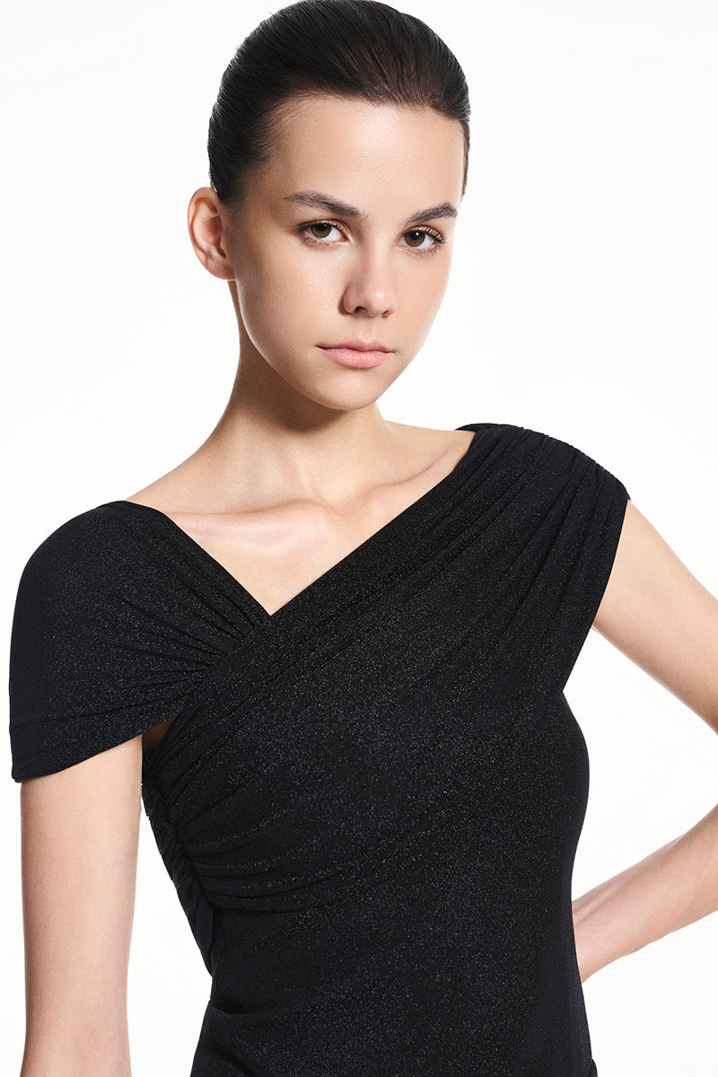 Black spandex knit maxi dress by EEGEN STUDIO, featuring a fitted silhouette and long sleeves, shown on a mannequin.