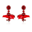 Aidan & Ice dew drop red earrings with elegant teardrop design, showcasing vibrant red gemstone accents on silver hooks.