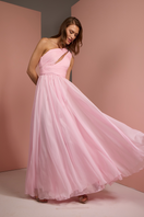Baby pink one-shoulder gown by Joanna Andraos, elegant dress with flowing fabric and stylish design for special occasions.