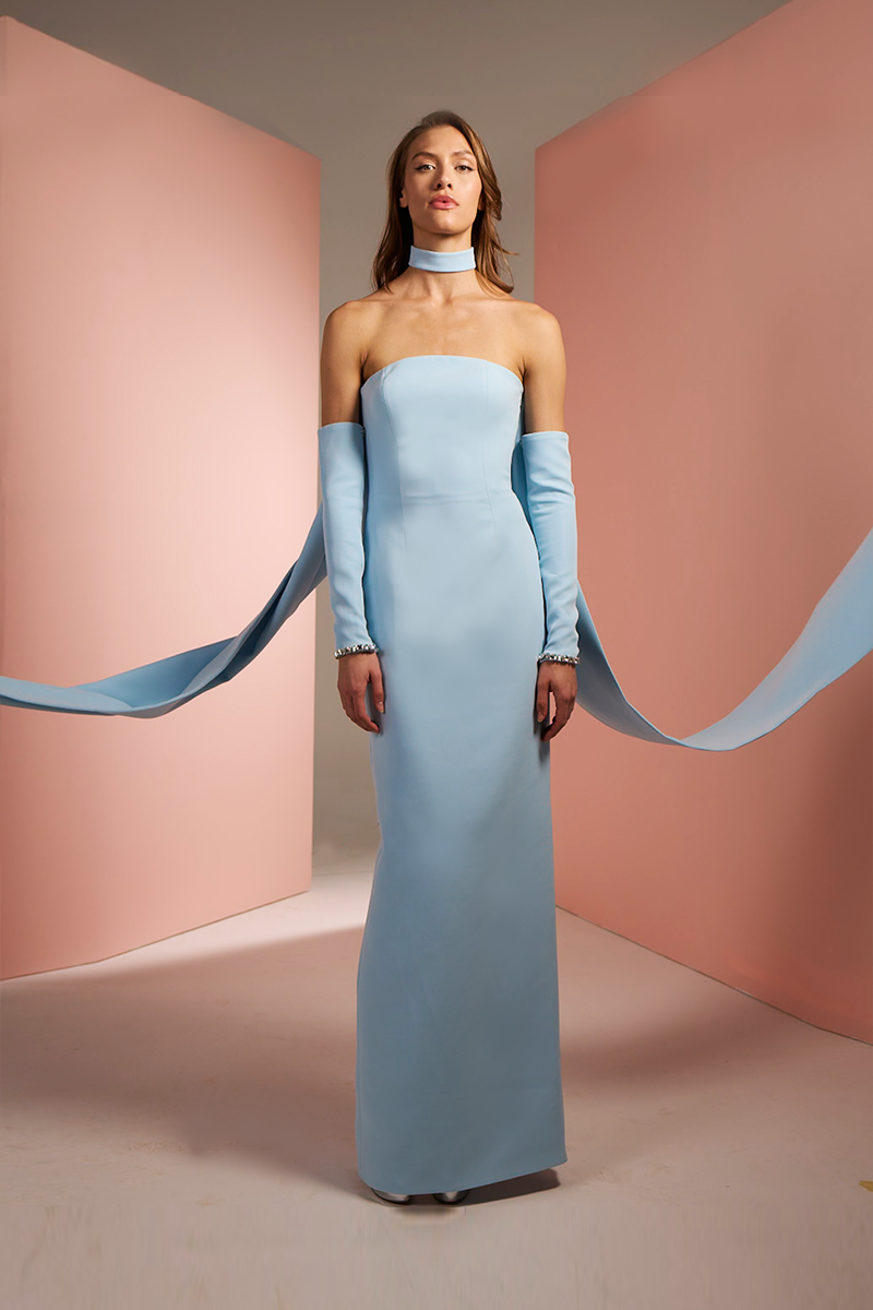 Baby blue strapless crepe tube gown by Joanna Andraos, featuring a sleek, fitted silhouette and elegant drape.