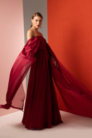 Red strapless gown by Joanna Andraos featuring a flowing, elegant design perfect for formal occasions.