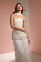 White Joanna Andraos strapless top and skirt co-ords set with matching scarf, styled for a fashionable editorial look.