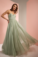 Light green strapless gown by Joanna Andraos, elegant formal dress with a flowing fabric and fitted bodice.