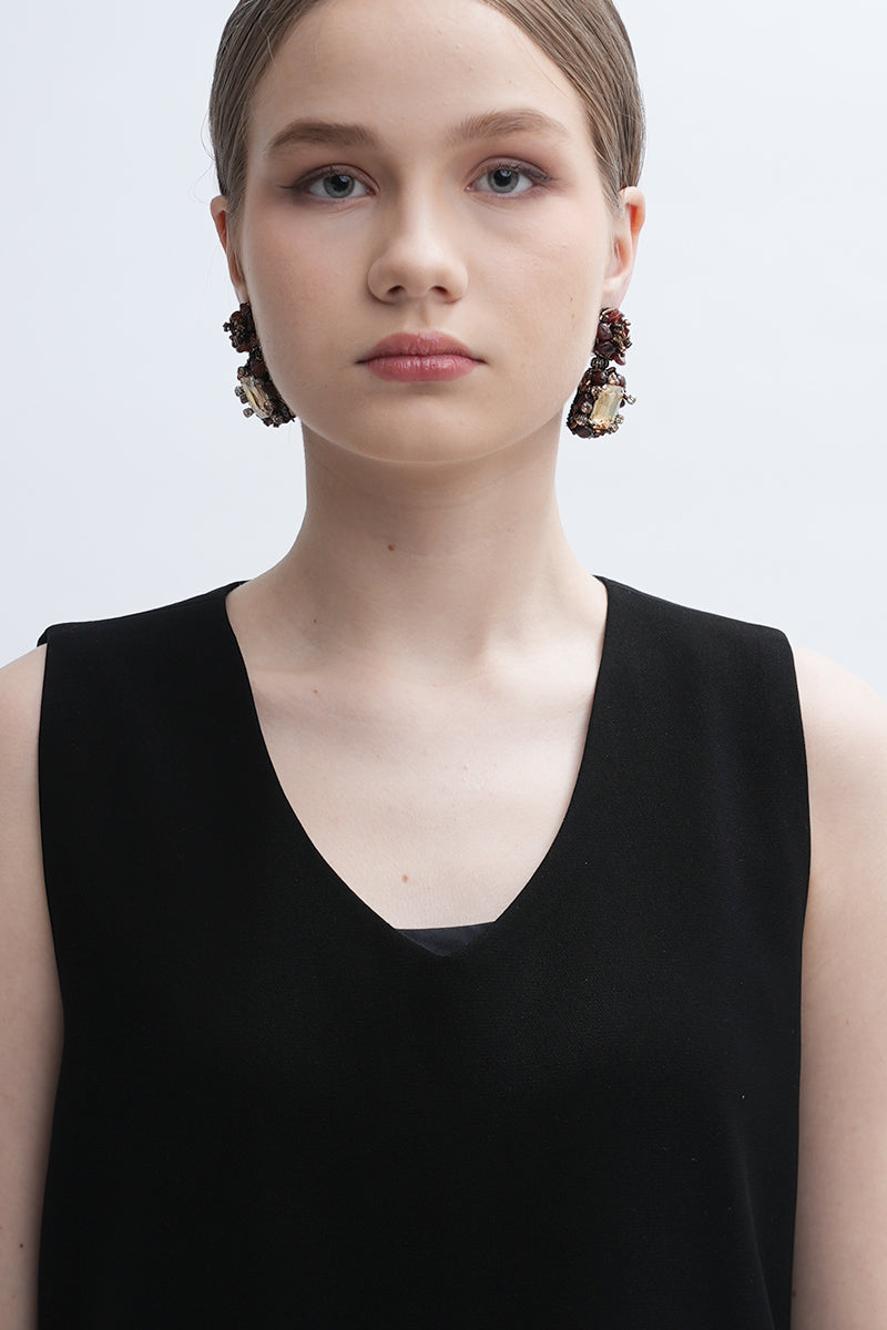 A pair of gold Amora earrings by Aidan & Ice featuring elegant, shiny gold design perfect for stylish accessories.