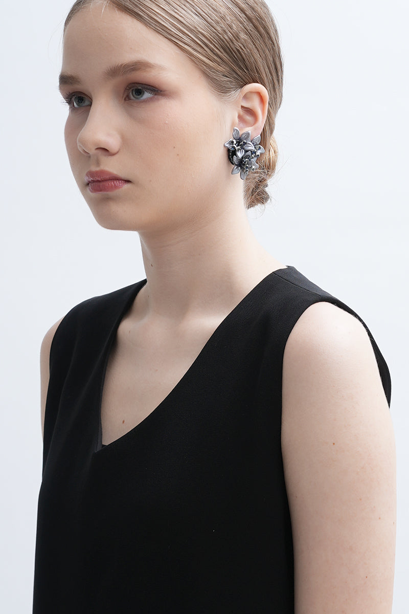 Gray Greta earrings by Aidan & Ice displayed on a neutral background, showcasing their modern, minimalist design.