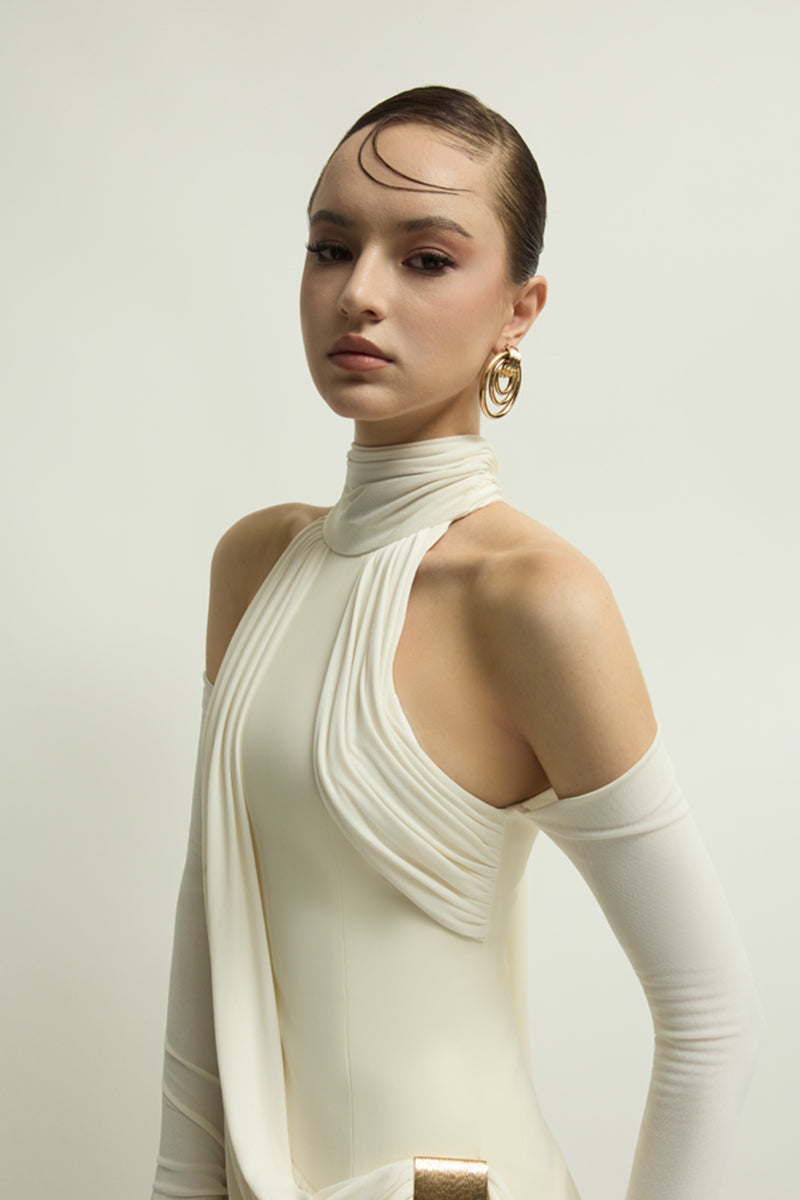 Elegant ivory EIRA gown by Jenny K Tran, featuring flowing fabric and intricate detailing, perfect for formal occasions.