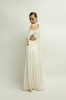 Elegant ivory gown by Jenny K Tran featuring a flowing design and subtle detailing, perfect for formal occasions.