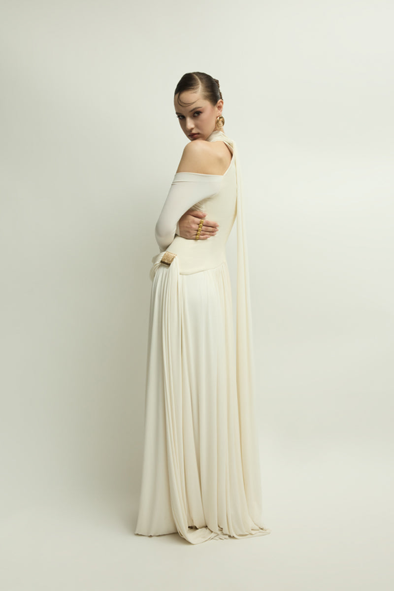 Elegant ivory gown by Jenny K Tran featuring a flowing design and subtle detailing, perfect for formal occasions.