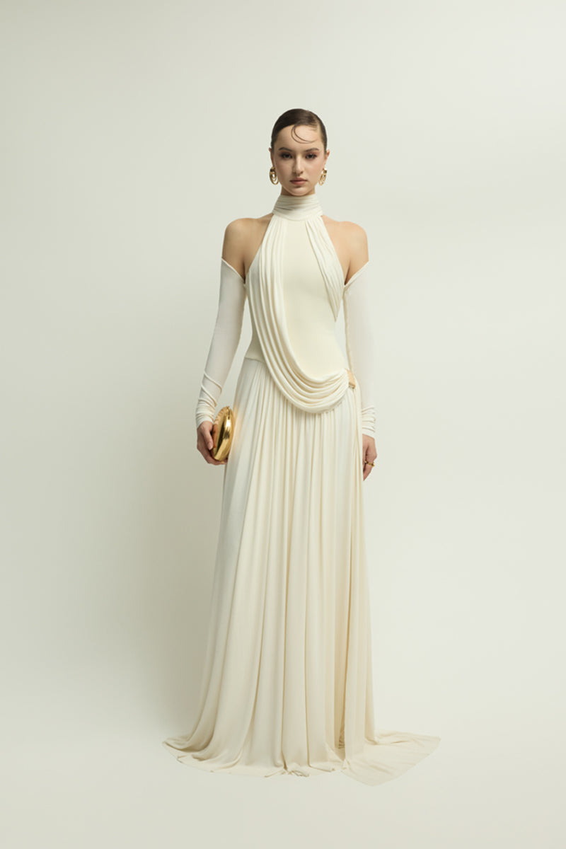 Elegant ivory gown from Jenny K Tran's EIRA collection, featuring a flowing design and soft, luxurious fabric.