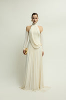 Elegant ivory gown from Jenny K Tran's EIRA collection, featuring a flowing design and soft, luxurious fabric.