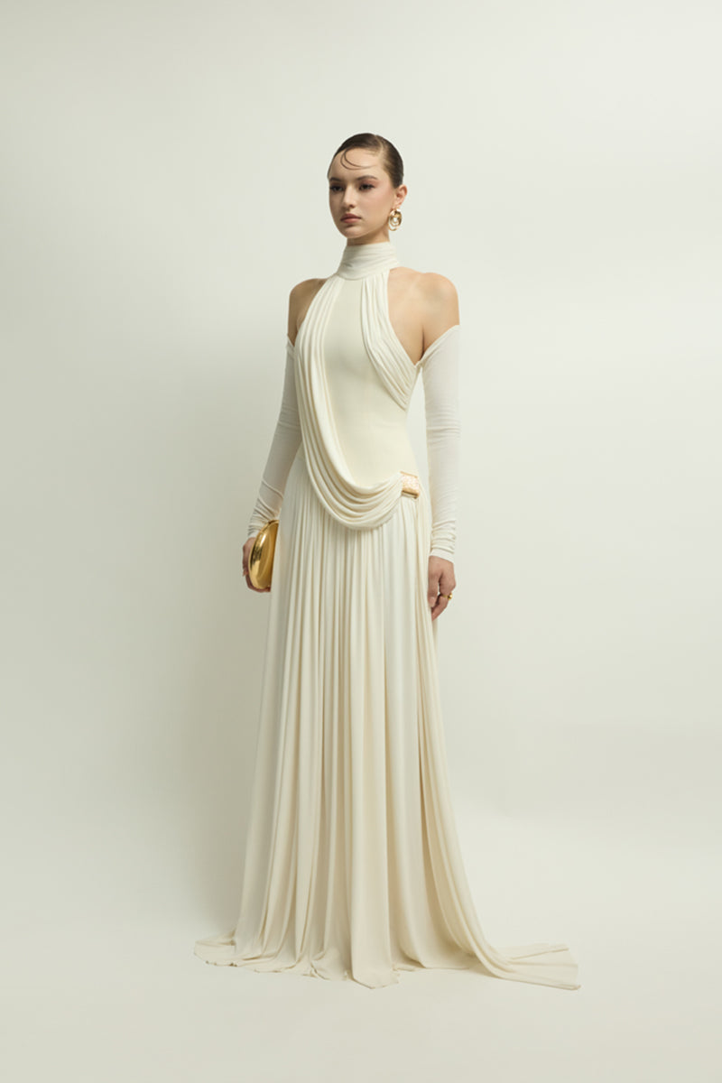 Elegant ivory gown from Jenny K Tran's EIRA DRESS collection, featuring flowing fabric and a sophisticated silhouette.