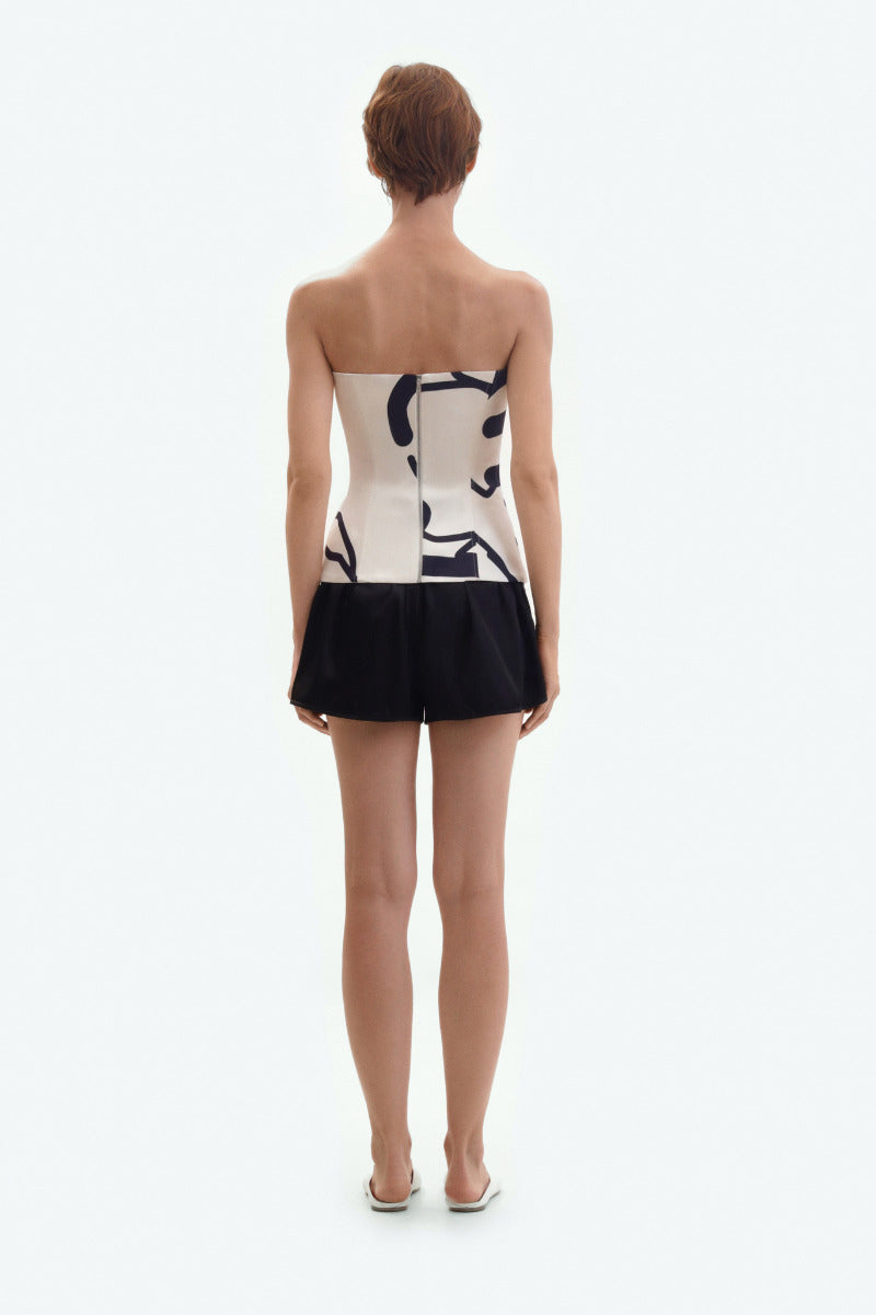 Cream corset top with black graphic lines by ELENAREVA, featuring a fitted design and bold printed pattern.