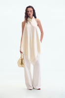Cream silk open-back blouse by ELENAREVA featuring a stylish back design and elegant fit, perfect for chic tops.
