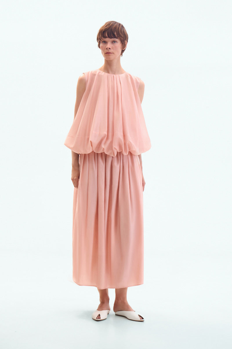Dusky pink balloon midi skirt by ELENAREVA, flowing fabric with a gathered waist, stylish and feminine for casual or dressy wear.