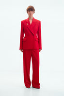 Red straight-leg trousers by ELENAREVA, tailored pants with a sleek fit, shown on a model against a neutral background.