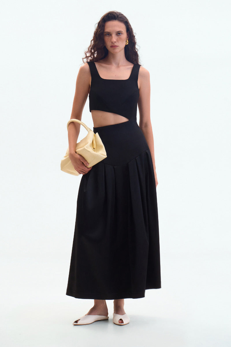 Black midi cutout dress by ELENAREVA featuring a sleek maxi dress with stylish cutouts and a fitted silhouette.