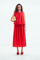 ELENAREVA red balloon midi dress displayed on a model, featuring a fitted waist and flowing skirt for elegant style.