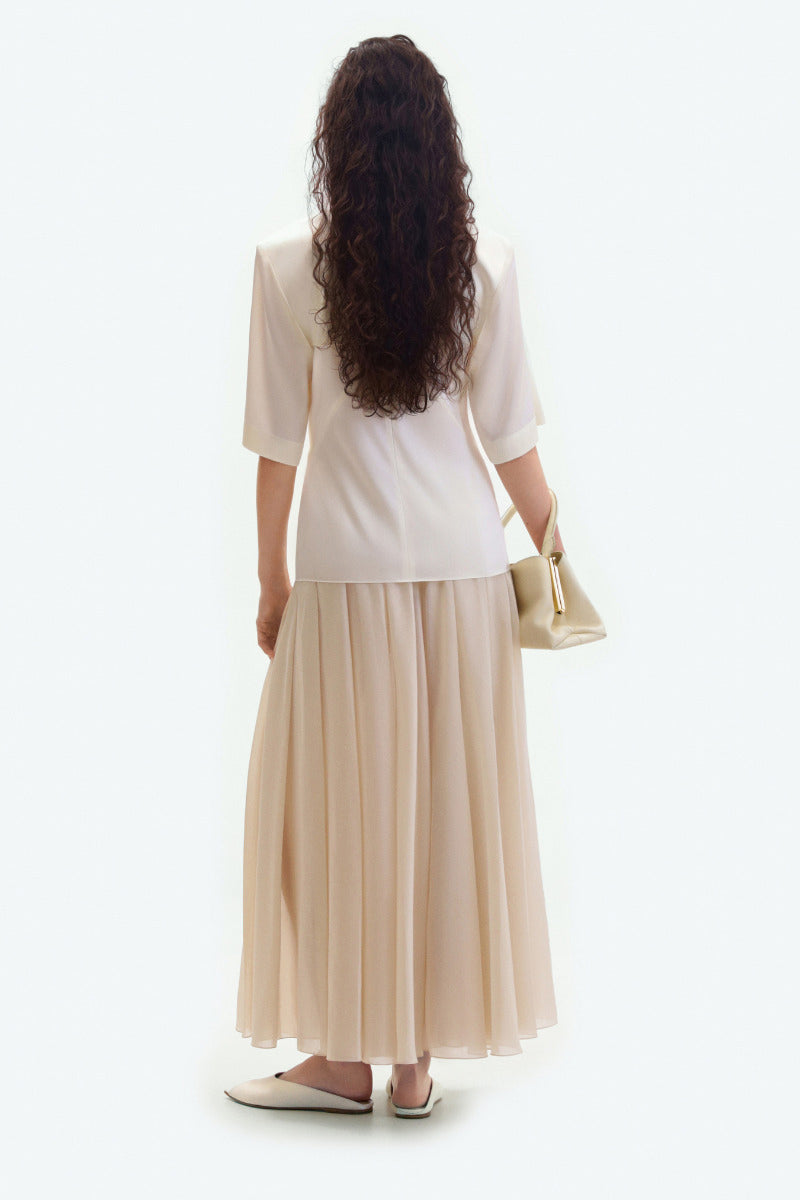Light cream sheer midi skirt by ELENAREVA, flowing and lightweight with a delicate, semi-transparent fabric perfect for elegant looks.