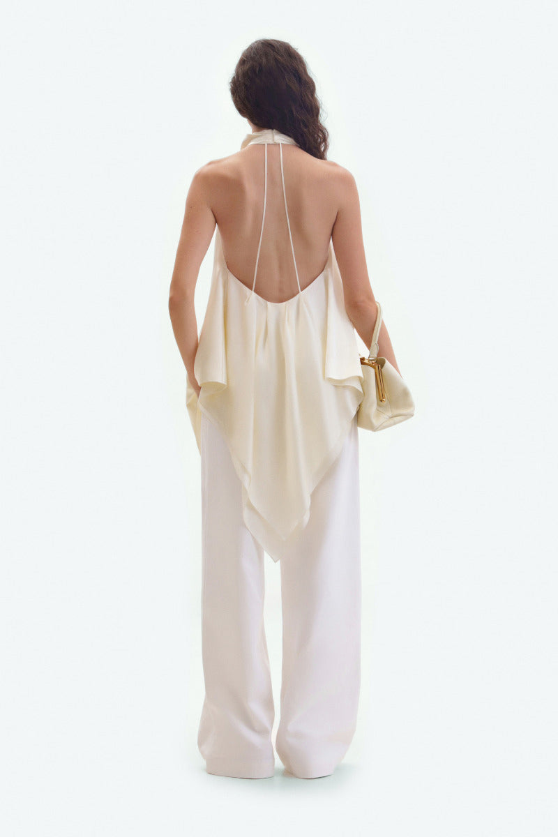 Light-colored ivory straight-leg jeans by ELENAREVA, showing the fit and classic denim details on a white background.