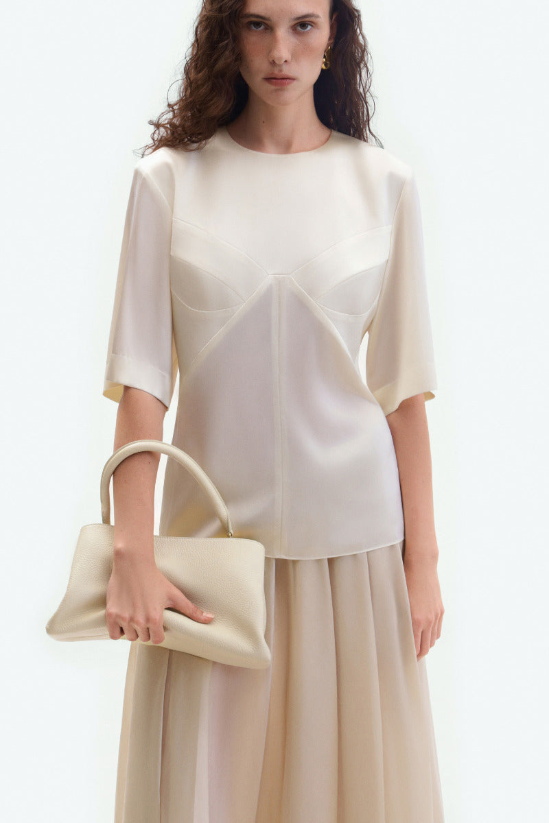 Cream sheer midi skirt from ELENAREVA featuring lightweight, flowy fabric and a classic midi length.