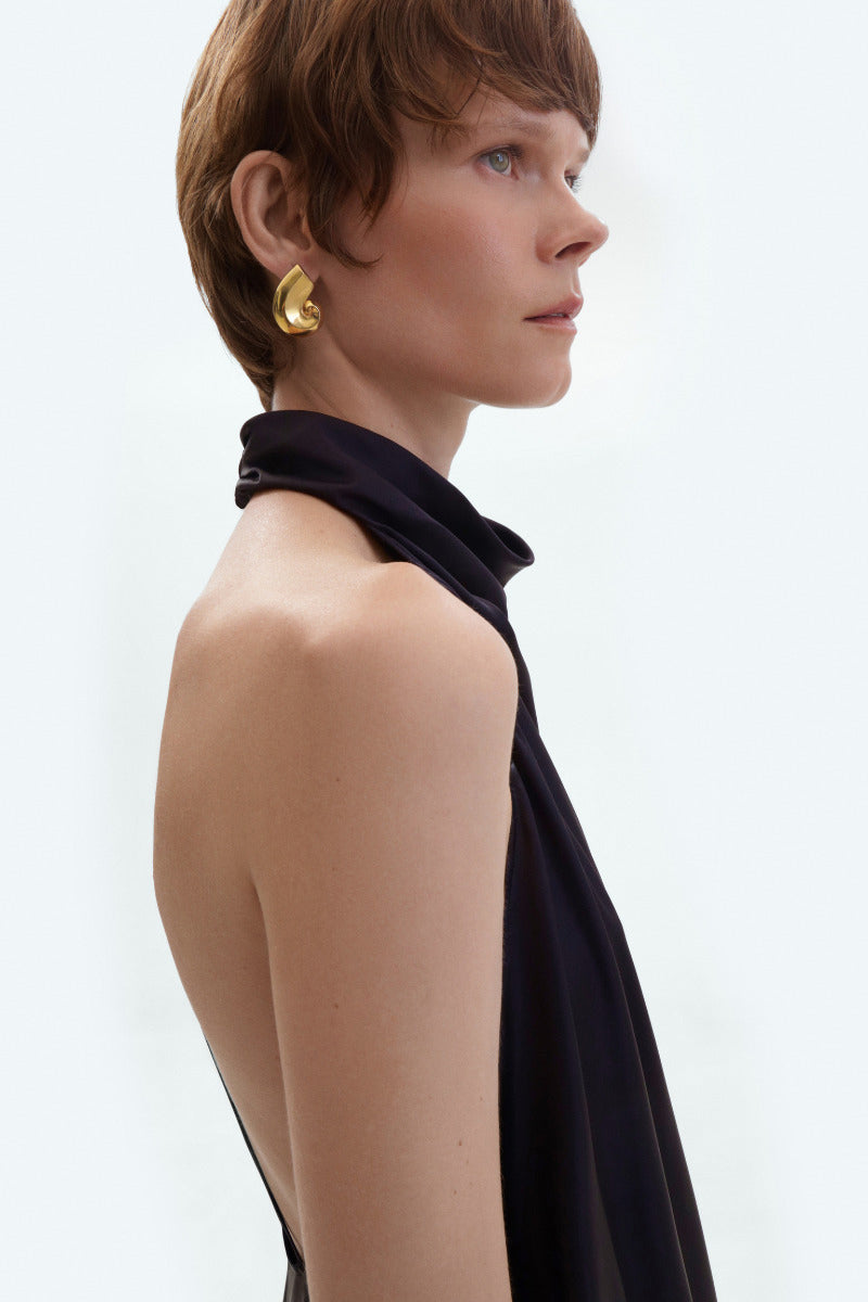 Black silk backless midi dress by ELENAREVA, featuring a sleek design and elegant backless style, perfect for formal occasions.