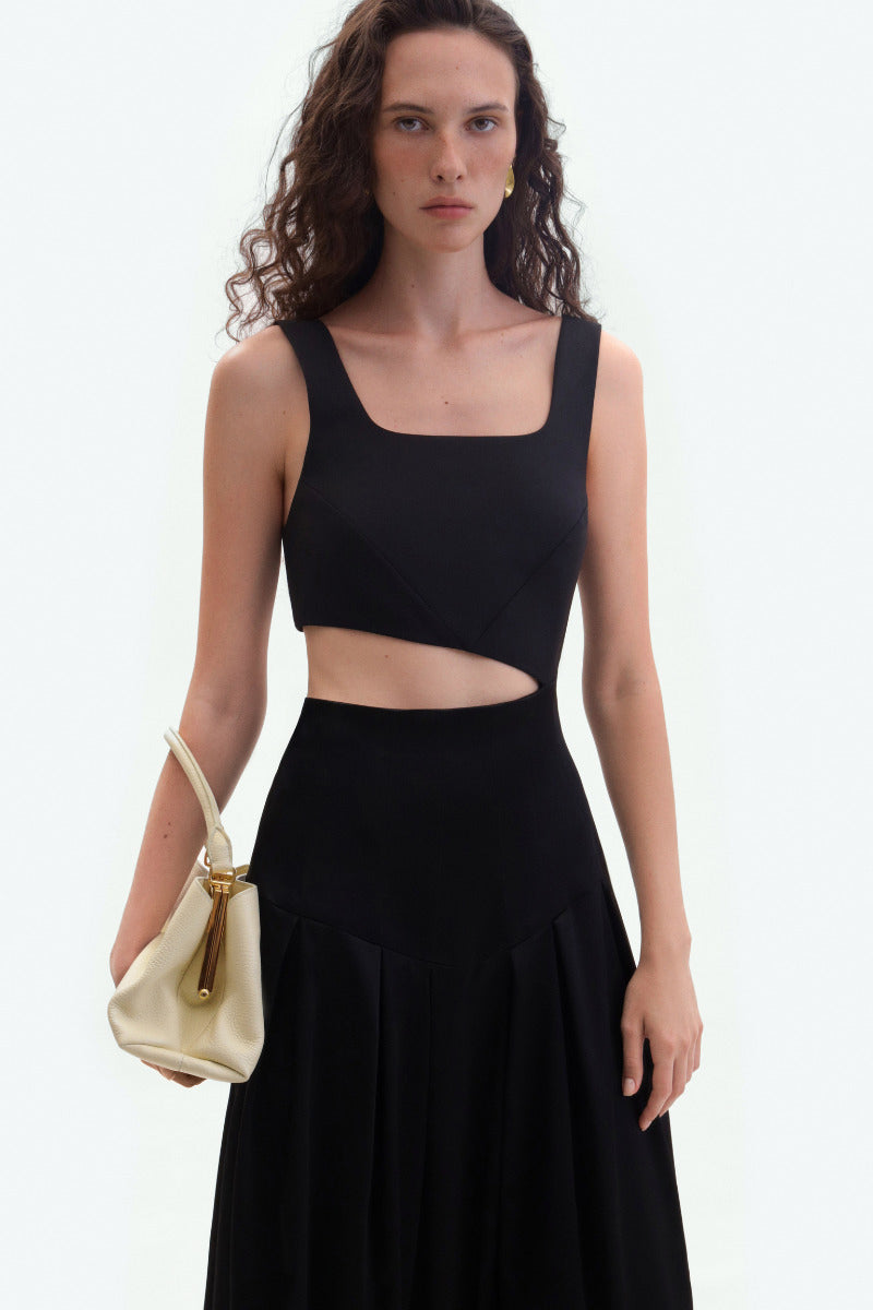Black midi cutout dress by ELENAREVA, featuring a stylish midi length and trendy cutout design, shown on a model.