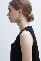 Aidan & Ice Louise earrings featuring elegant hoop design with sparkling accents, displayed on a neutral background