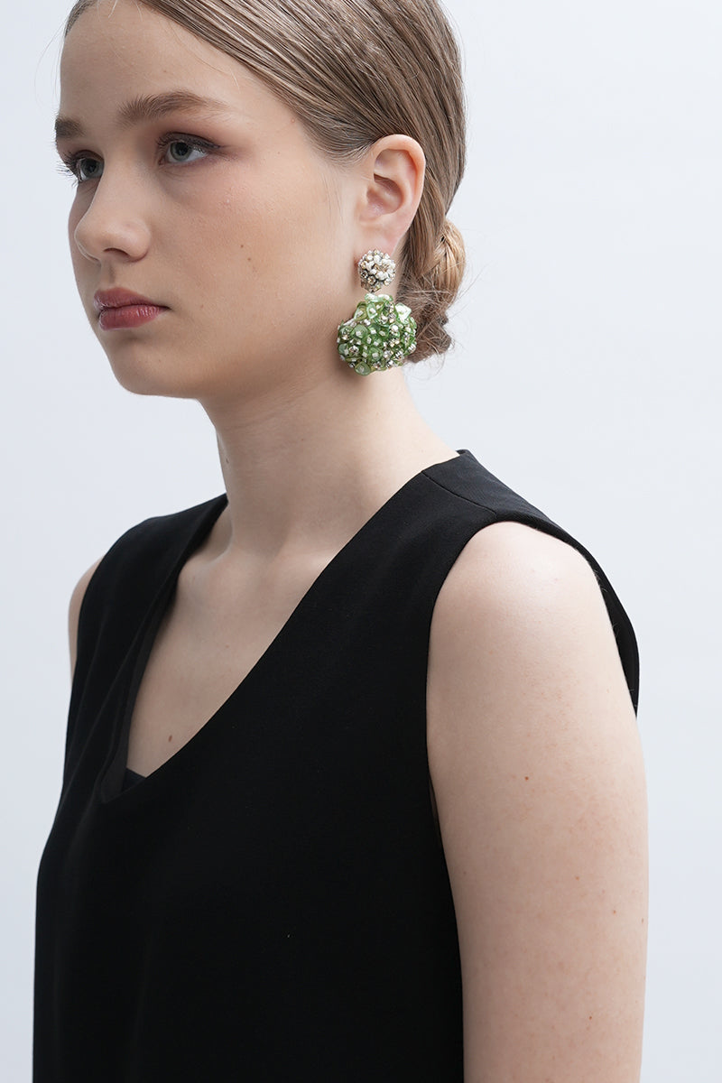 Aidan & Ice Louise earrings featuring elegant gold hoops with intricate detailing on a white background.