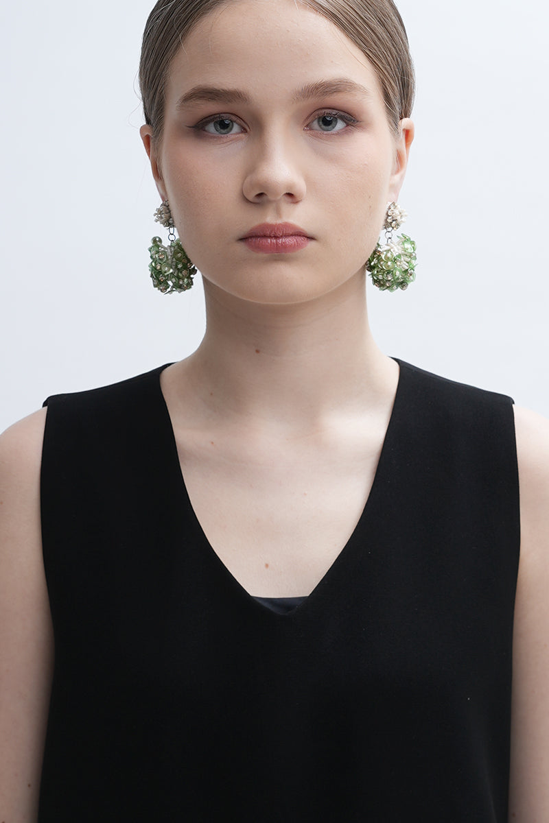 Aidan & Ice Louise earrings featuring elegant, silver-toned dangle earrings with intricate design details.