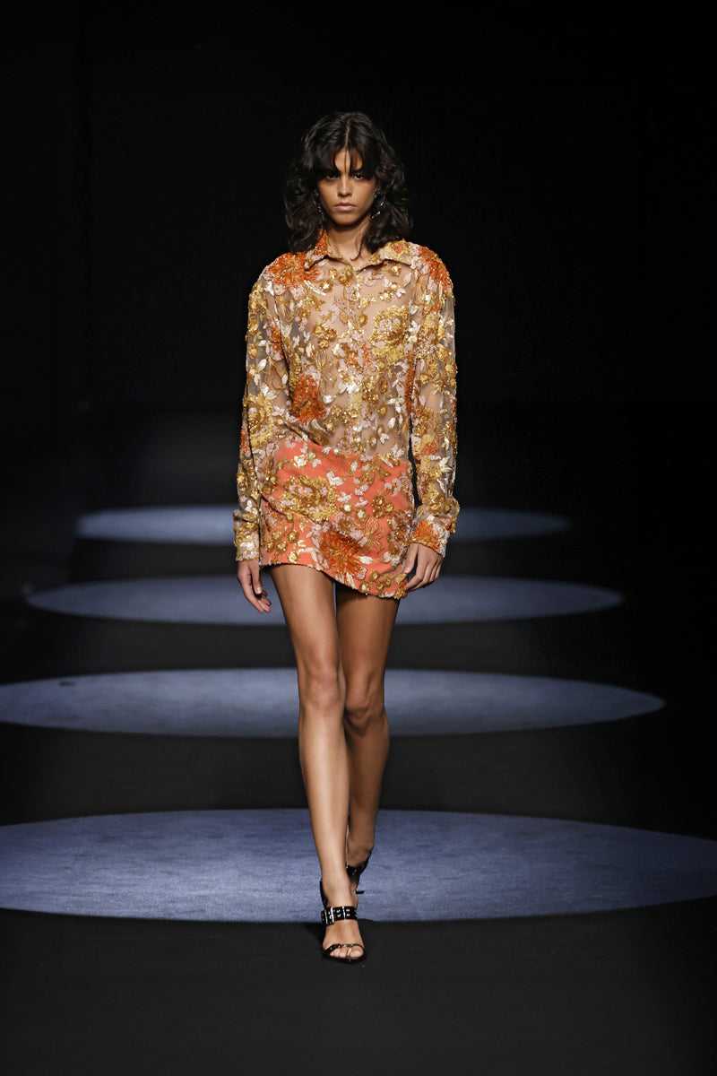 Embroidered low waist mini skirt by JC Pajares featuring intricate embroidery and a stylish short design.