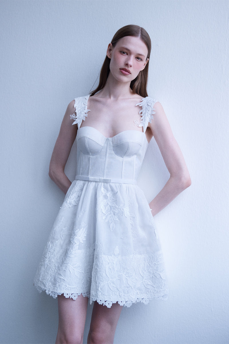 AISA Emma white mini dress with a fitted silhouette, featuring sleeveless design and stylish neckline, perfect for summer wear.