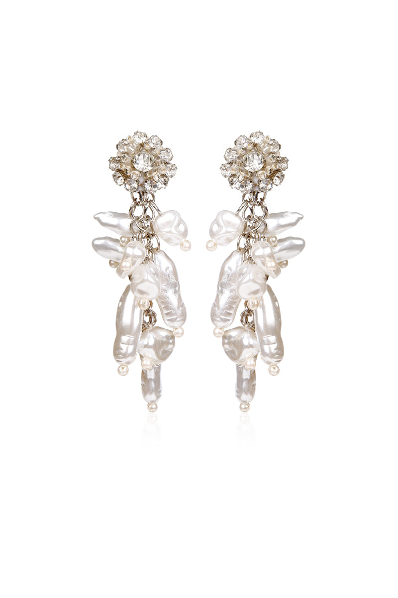 A pair of white earrings from Aidan & Ice, featuring sleek, minimalist design, displayed on a neutral background.
